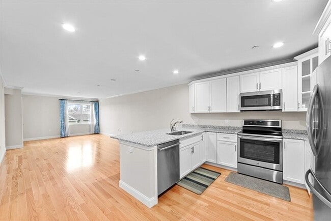 Photo - Top-Floor 2BR Condo with Balcony, Garage Parking & Amenities in Lexington Unit 244