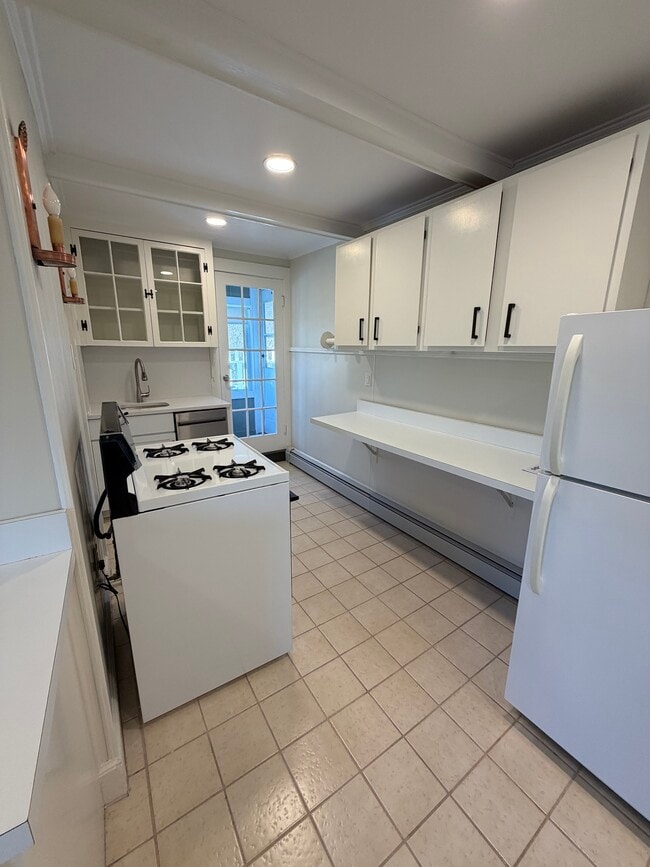 Eat in kitchen with gas stove, new dishwasher~ back door leads to screened in porch and large deck - 19 Irving St Unit #3-J