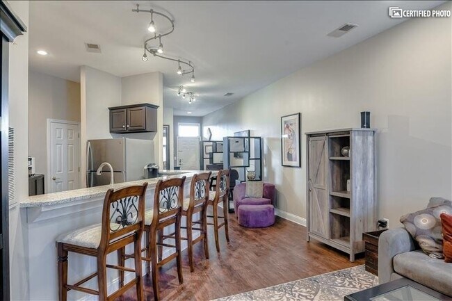 Living Area/Bar Seating area - 300 E John St Unit FURNISHED ALL INCLUSIVE