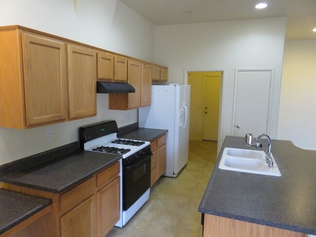 Photo - Huge family room with kitchen nicely tucked in the middle.