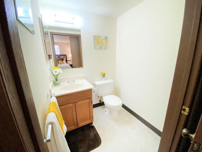 One and a Half Baths Available in Select Floor Plans - Crown Pointe Apartments