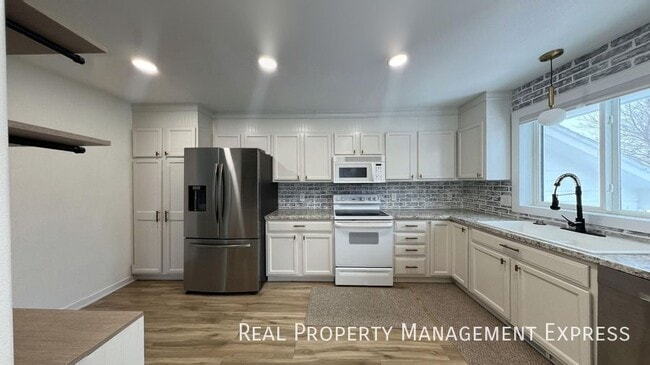 Photo - Spacious 4BR, 2BA Gem with Fireplace and Open Basement