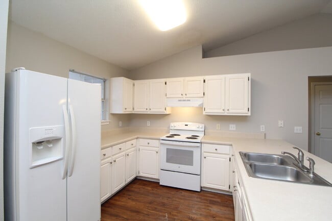 Photo - 3BR/2BA Brick Home with Vaulted Ceilings, Open Living Areas, 2-Car Garage & Fenced Backyard Near ...