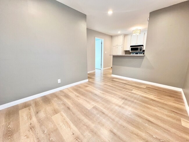 Photo - Contemporary 2 Bed Condo with 2 Garage Parking Spaces, Community Pool, and 3 Private Balconies