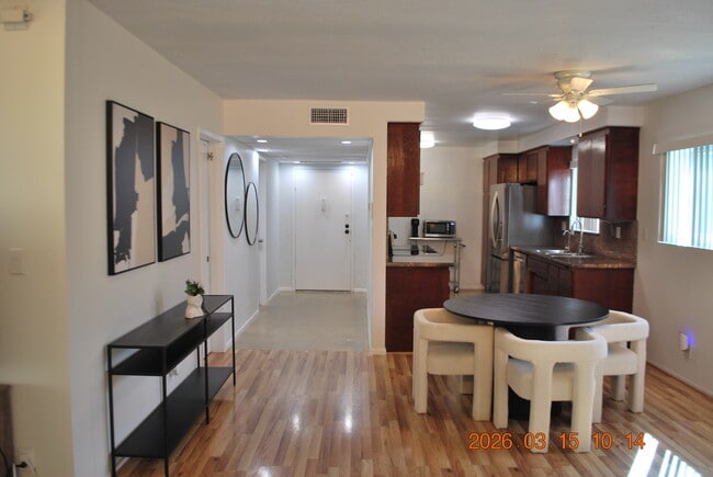 Dining and kitchen from entry - 612 N Louise St Unit 307
