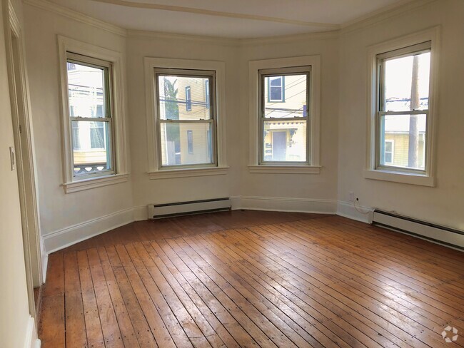 Living room bay window, hardwood floors - 30 Royal St Unit Apt 1