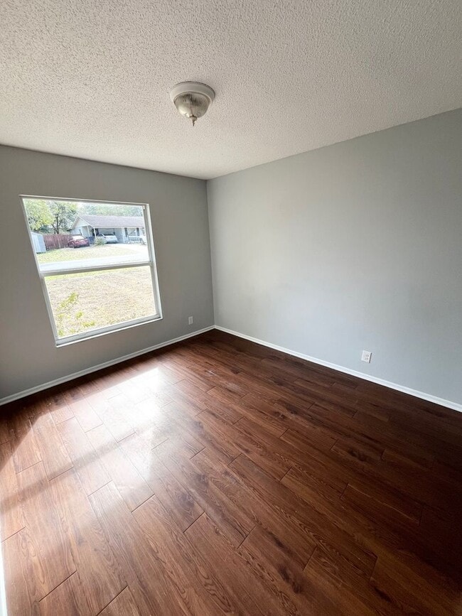 Photo - SPACIOUS 3BR/1.5BA w/Carport, Beautiful Wood Finish Flooring, Privacy Fenced Backyard! NO APP FEE!