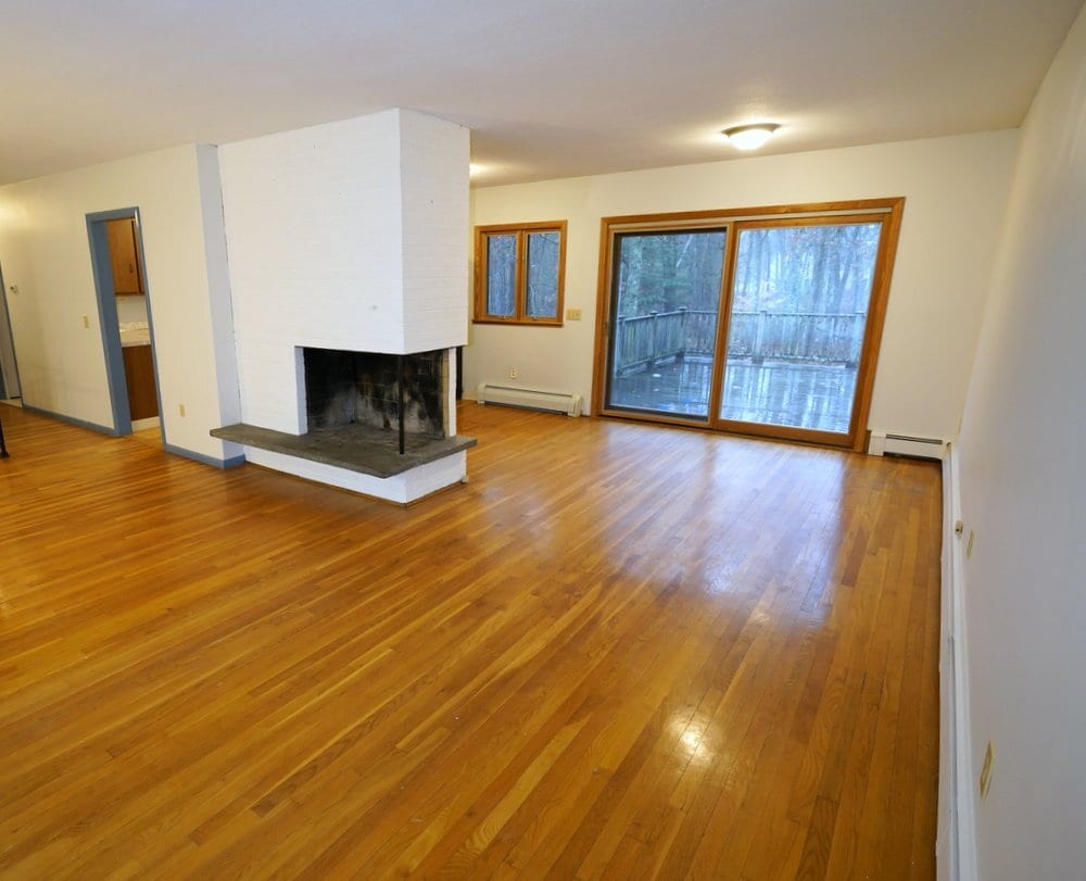 Living Room and Dining Room with sliding door to large private deck - 208 Grove St (Lexington, MA)
