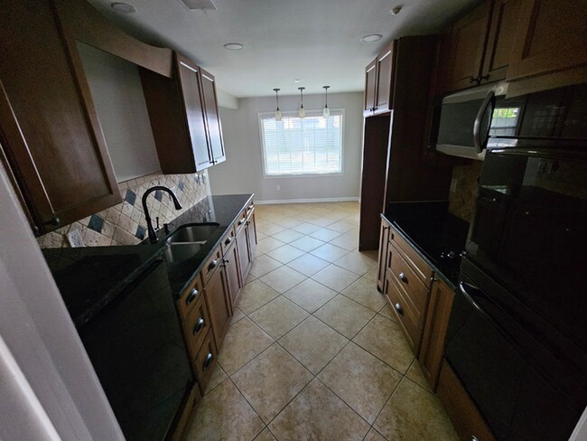 Photo - Spacious 3BR/2BA Memphis Rental with 2-Car Garage, High Ceilings & Screened Porch
