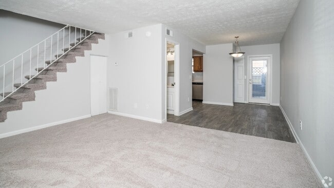The Roswell floor plan features an open layout with plush carpeting and direct access to the dining area.