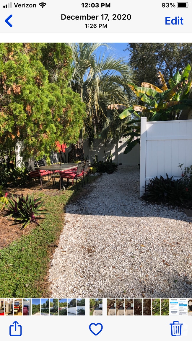 The shell driveway and pathway takes you to your gated entrance. - 5703 Murdock Ave Rental
