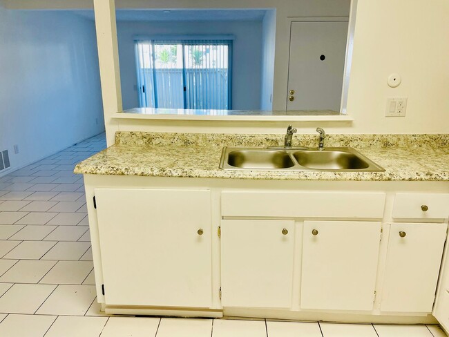 Photo - Charming 2-Bedroom, 1.75-Bathroom Unit with Garage, Patio & Community Amenities! Unit 208