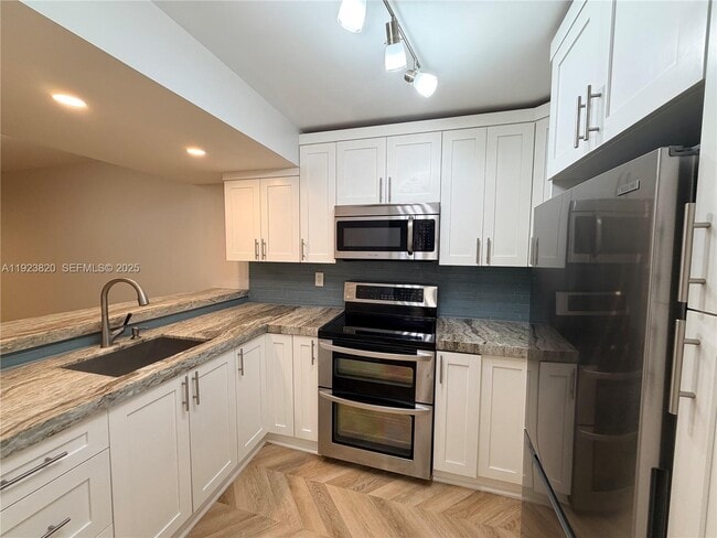 Building Photo - 13255 SW 88th Ln Unit 107-CS