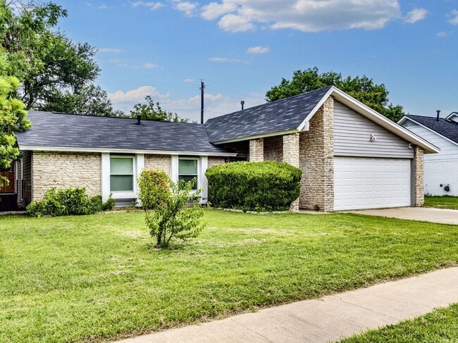 Photo - Charming 4BR / 2BA Home Featuring Fireplace, White Cabinets & Big Tree