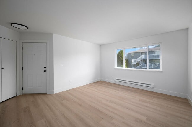 Step into this sunlit modern living space, perfect for personal touches and creativity.