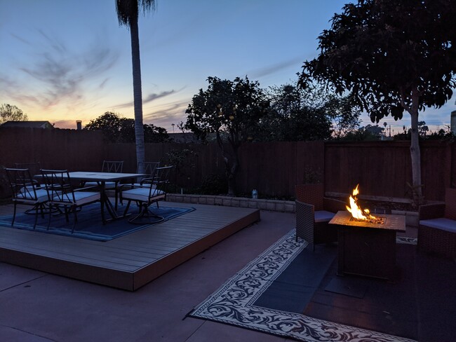 Relax by the firepit, on the hammock or dine al fresco. - 4848 Diane Ave Townhome