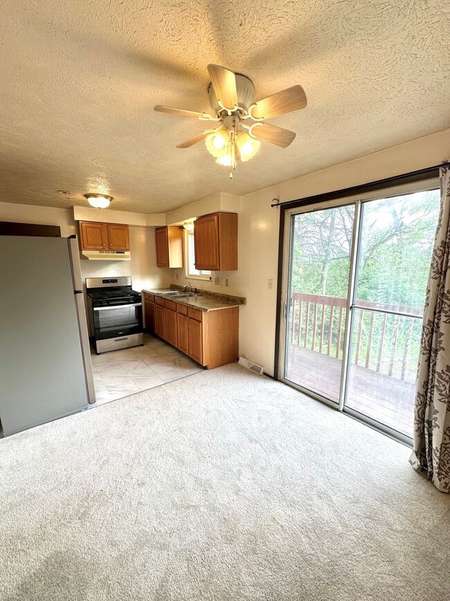 Photo - Well-Maintained 2 Bed, 1 Bath Townhome in West Mifflin - Private Balcony, Central AC & Heat - Ava...
