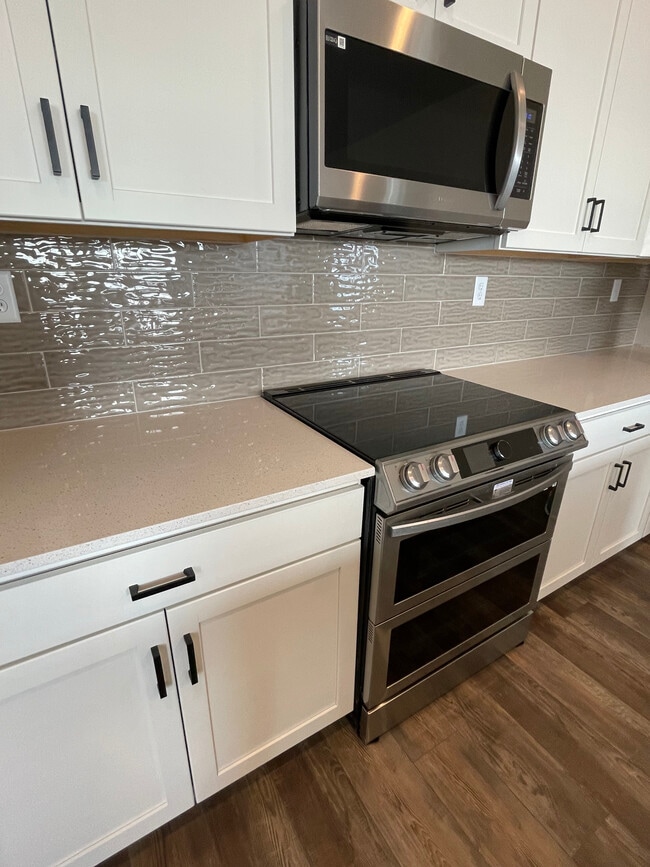 Spacious kitchen with induction stove top - 1800 Iron Wheel Dr Unit #6