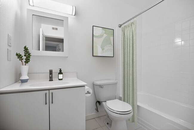 Elevate your living experience at The Woods at Ambler, an Eagle Rock Community. This beautifully designed bathroom features modern fixtures and a clean aesthetic, perfect for your daily routine. Schedule a tour today! - The Woods at Ambler, an Eagle Rock Community