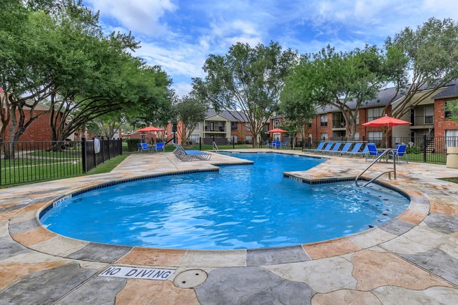 Relax by the poolside - Harbor Walk Apartments