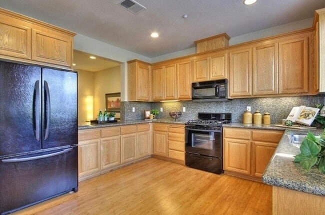 Photo - UPGRADED TOWNHOME IN RIVERMARK SOUGHT-AFTER WALK-UP SETTING