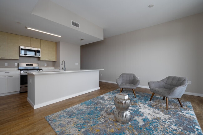 1BR, 1BA - 766SF - Living Room and Kitchen
