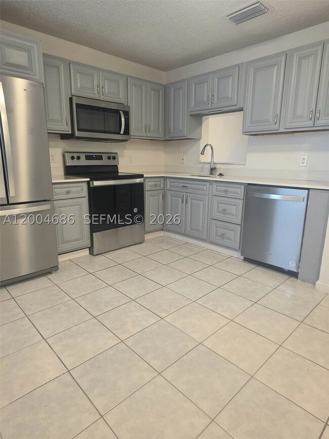 Building Photo - 8958 W Sample Rd Unit 8958