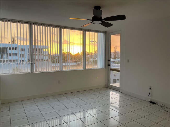 Building Photo - 8233 Harding Ave Unit 408