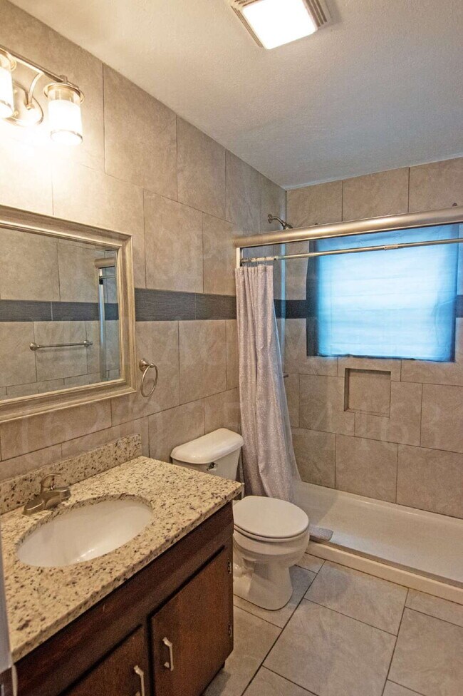 Photo - Spacious 2-Bedroom Apartment with Off-Street Parking & On-Site Laundry