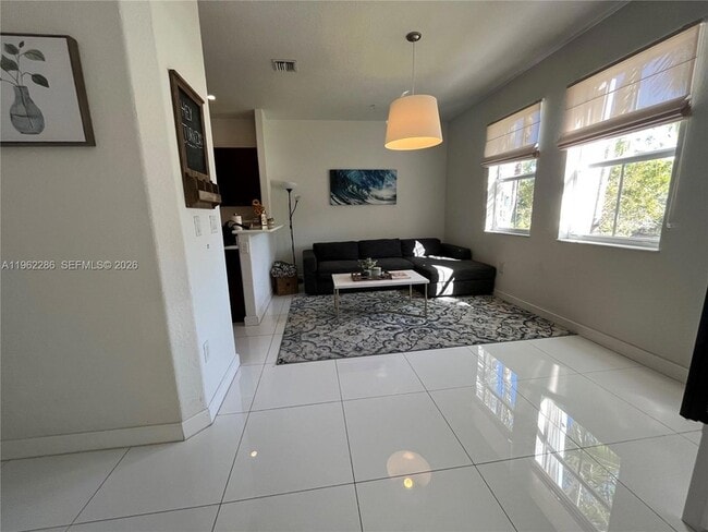 Building Photo - 10012 NW 7th St Unit 203