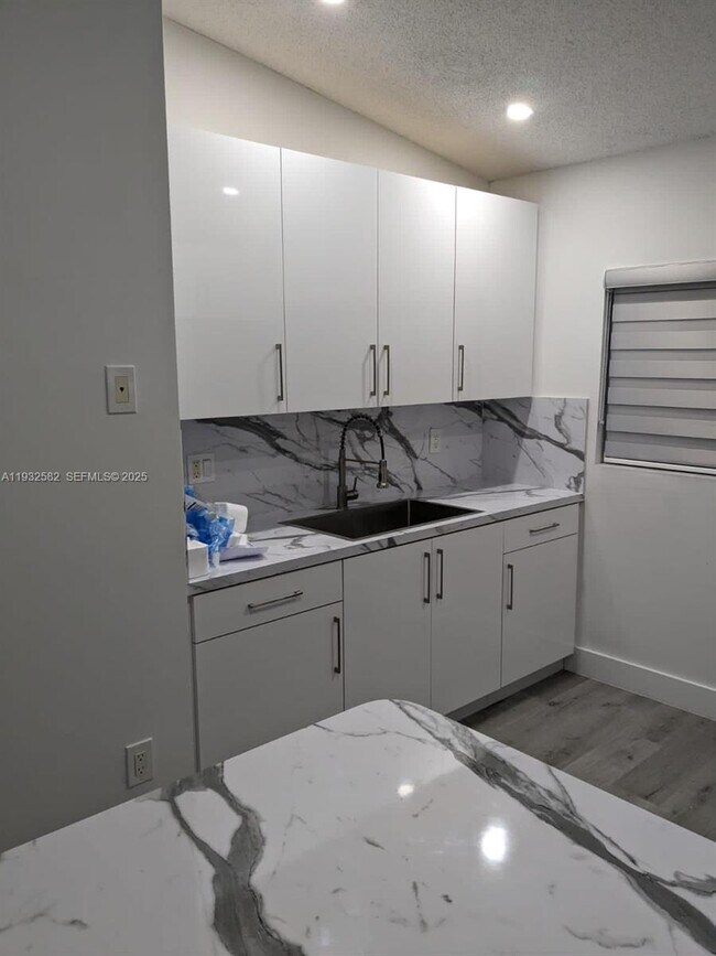 Building Photo - 7956 W 29th Ln Unit 201-5