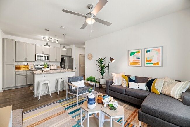 Nova-Knoxville-Formerly-Aspen-Heights-Knoxville-Off-Campus-Apartments-Near-The-University-of-Tennessee-Knoxville-Open-Floor-Plan-Fully-Furnished-Living-Room-to-Kitchen