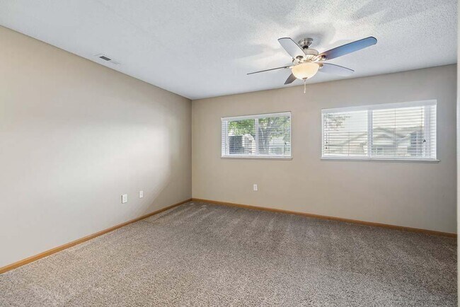 Large windows and an expansive layout fill this spacious bedroom with natural light, creating a comfortable retreat you'll look forward to every day.