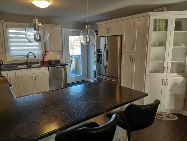 Photo - 166 Cougar Crescent Unit 1