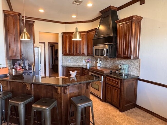 Photo - 3 bed plus office , 3 car garage with storm shelter, shop with electric and covered patio in Moor...