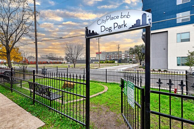 Dog Park in the front yard. Has 2 large benches with cupholders, room to run around and even a fire - CityPlace BNB