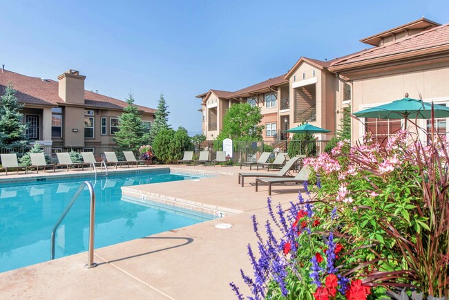 Pool with covered seating - Talon Hill Apartments