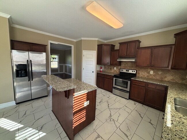 Photo - This property blends ample living space and storage with functional amenities.