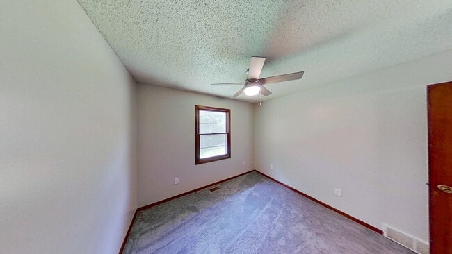 Photo - Clean three bedroom one bath duplex with walk out basement with yard looking at trees, across fro...