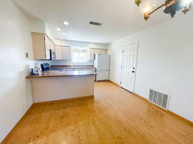 Photo - This gorgeous Pine Hills home has a large interior, 2-car garage, and fully-fenced yard!