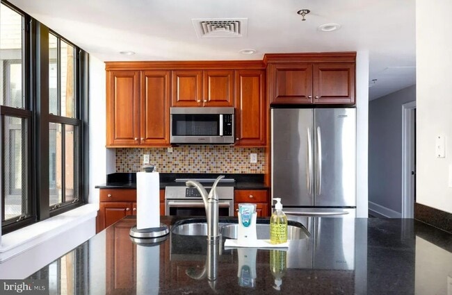 Photo - Spacious 4-Bedroom Residence with In-Unit Laundry in Center City