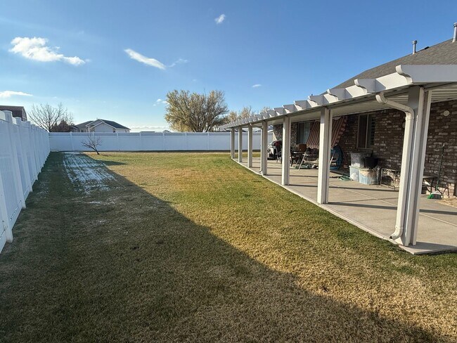 Photo - Beautiful patio home with 2 car garage, central air, fenced yard and covered patio