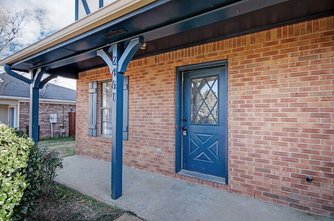 Welcoming covered front porch — the perfect spot for morning coffee or evening relaxation. - 2461A River Oaks Blvd