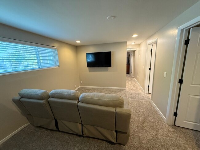 Living room - 825-11575S E Sunburn Ln Unit Sunny Basement Apartment