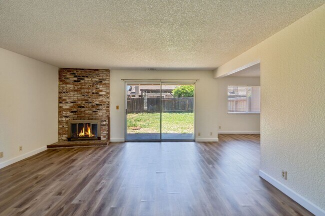 Photo - 3 Bedroom Home with Fireplace and LVP Flooring & 2-Car Garage!