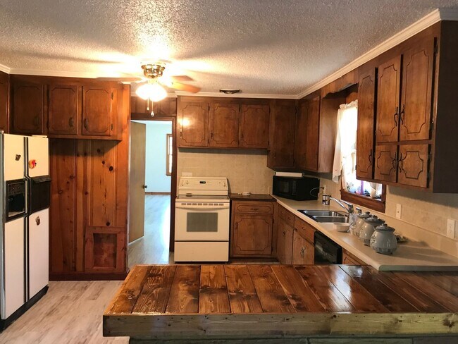 Photo - Spacious 3-Bedroom Home in the Heart of Baxter | Basement + Wrap-Around Driveway