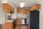 Cook in style with stainess steel appliances, warm wood cabinetry, and plenty of counter space in your updated kitchen.