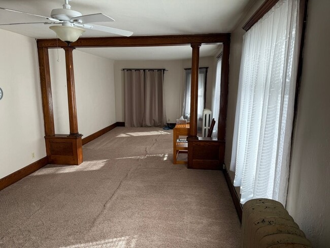 Photo - *NO PET DOGS* Upper 1 bedroom all Utilities included Unit 2 Bed - Front Building - Upper Left