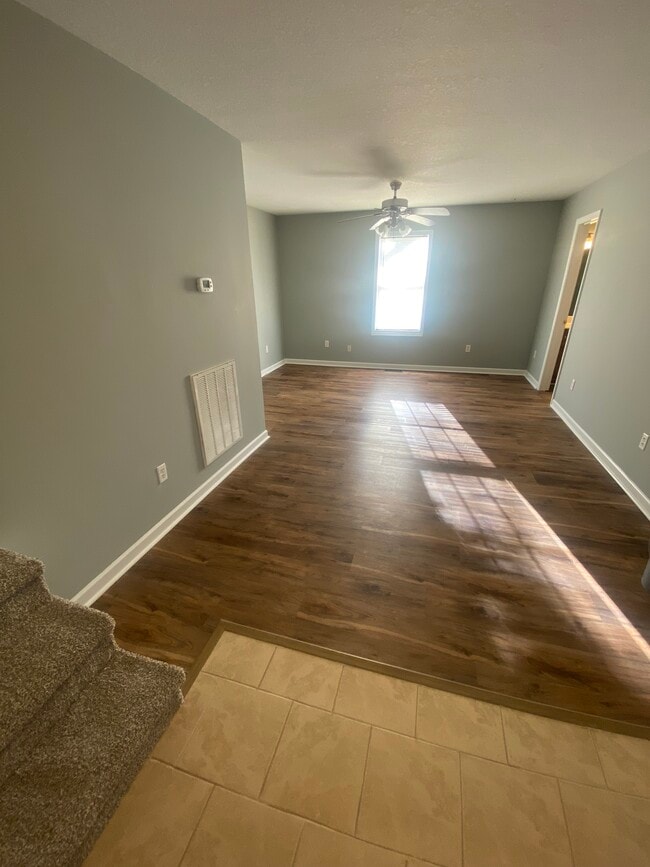 Living room with LVP flooring. - 317 N Anderson St Unit 317