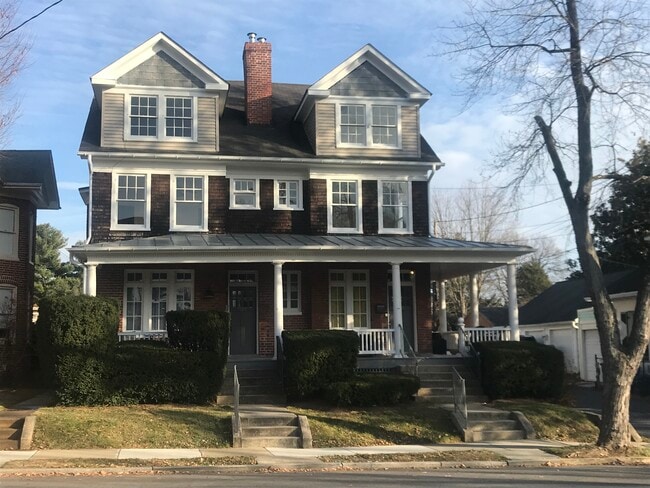 Street view showing the large shared front porch - 404 Elm St Unit Apartment 2